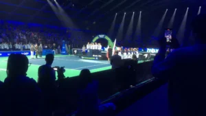 Stage setup with professional lights and sound system at the Billie Jean King Cup during a ceremony with teams and officials