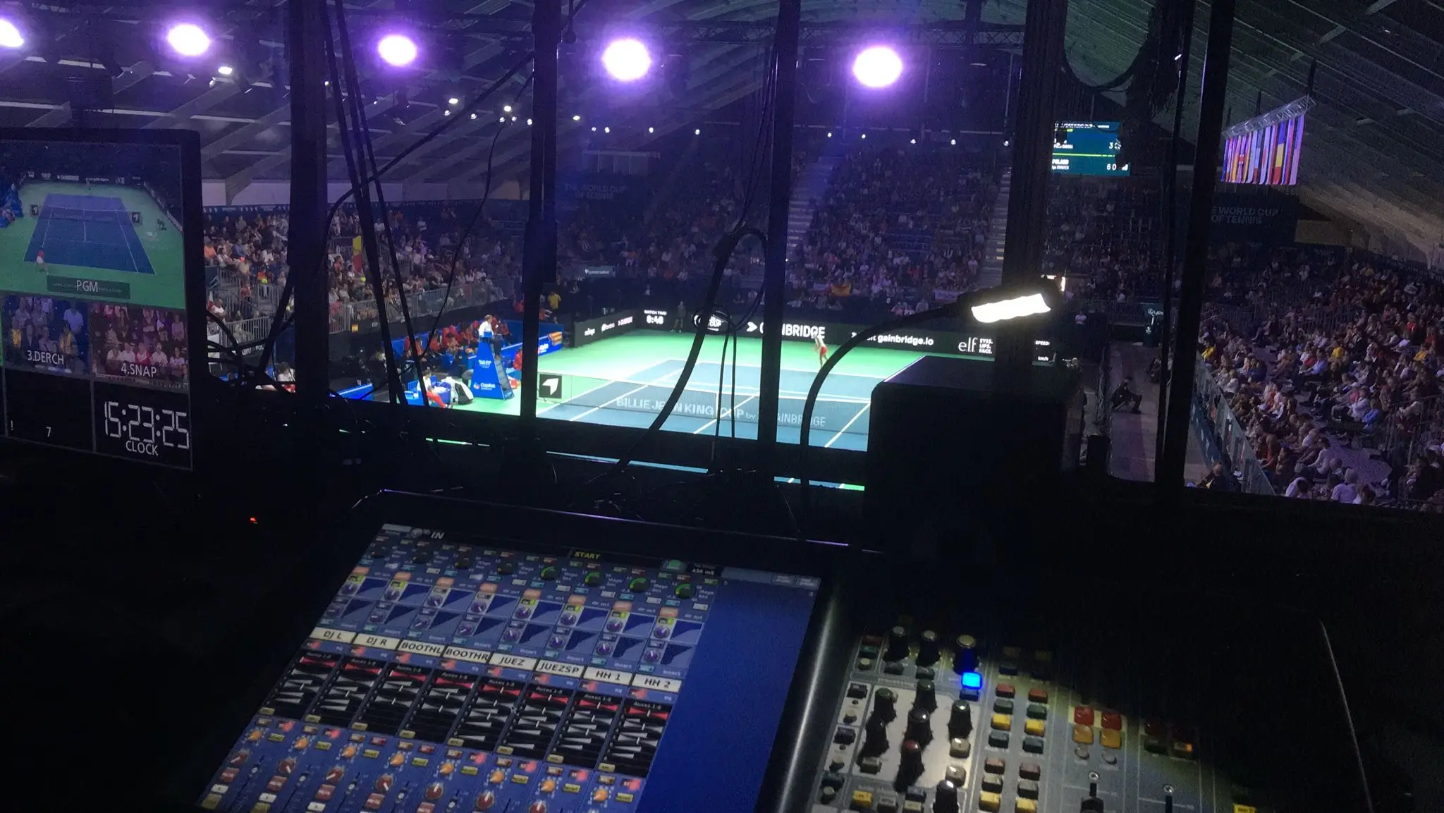 Professional sound system control panel with a live view of the tennis court during the 2024 championship