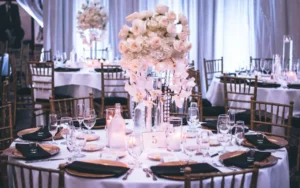 Elegant wedding reception table setting with white floral centerpieces, wedding.