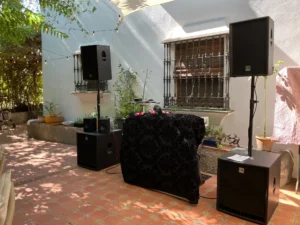 Full HK Audio column array speaker system and wireless microphone setup for outdoor DJ audio and microphone system setup in Malaga.