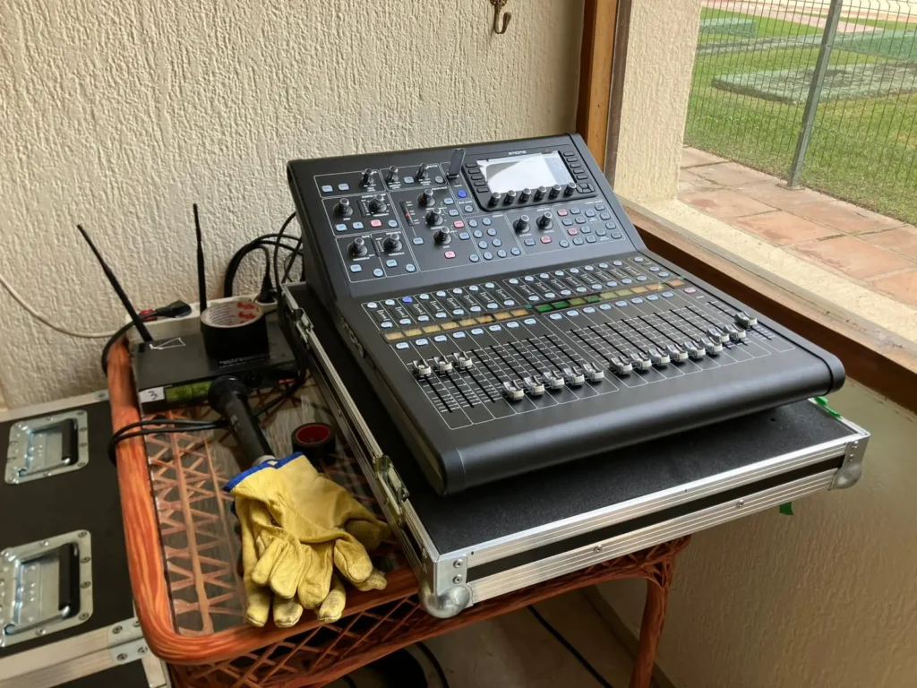Close up of a digital audio mixing console used for sound system rental at a community meeting in Malaga, Spain.